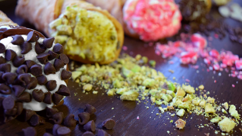 Colorful cannoli on table