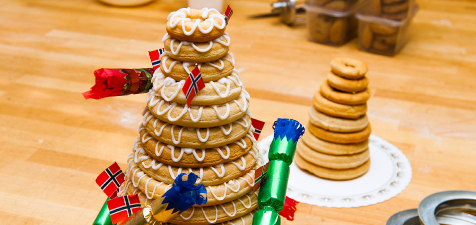 A tall Kransekage cake with new year's decorations