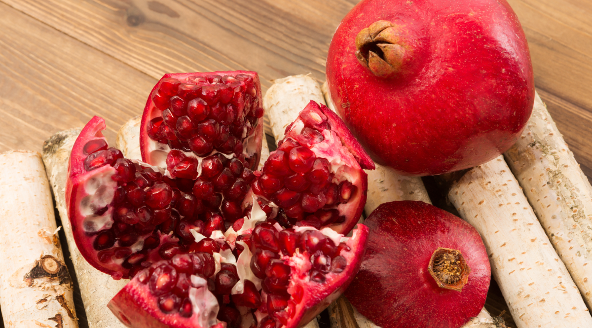 Scored and pried open pomegranates