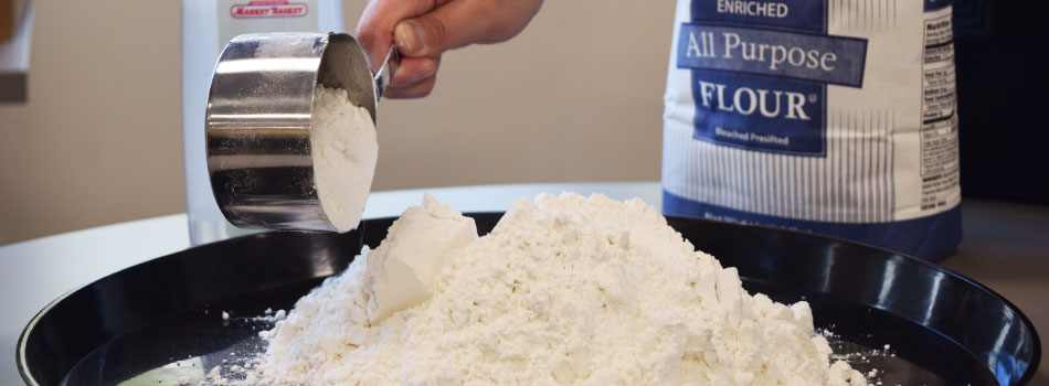 Market Basket flour is poured onto a black serving dish